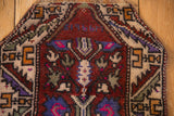 Close-up of the woven '1966' date inscription inside the vintage Oushak rug's prayer niche.