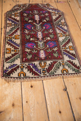 Distressed Oushak rug mat featuring a prayer niche top and a serrated leaf border.