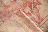 The hand-knotted back and secure, machine-bound edge of a distressed Oushak rug runner.