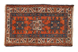Vintage Karaja rug with terracotta field, triple geometric medallion, and blue palmette borders.