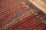 Prominent abrashes on the dusty rose field, with repeating sapphire blue botehs, antique Kurdish Hamadan rug.