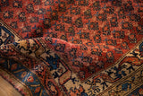 Folded antique Kurdish Hamadan rug pile, with dusty rose and sapphire blue abrash.