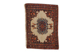 Antique Farahan Sarouk saddle bag with a starburst medallion, perched birds, and ivory ground.