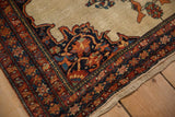 Sharp serrated contour of a corner spandrel on an antique Farahan Sarouk saddle bag rug.
