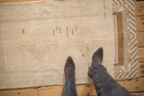 A personal view of the distressed, low-pile texture of a vintage Malatya rug.