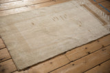 Back of a distressed Malatya rug, highlighting the texture of the hand-knotted foundation.