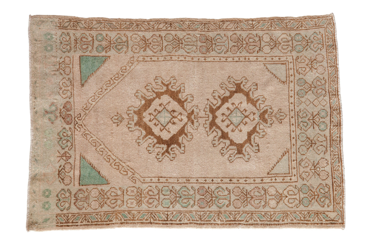 Vintage distressed Oushak rug with a double medallion prayer design in platinum, bronze, and pale turquoise.