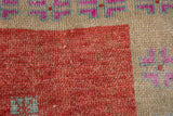 Close-up of the distressed pile showing even wear to knot heads and scattered white knots.