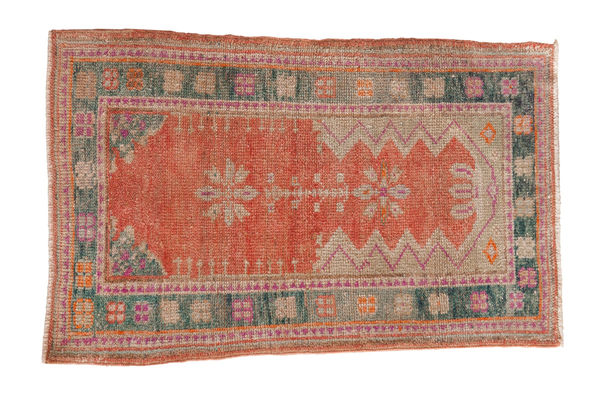 Distressed Oushak rug with a melon prayer design, zig-zag mehrab, and a dusty teal geometric border.