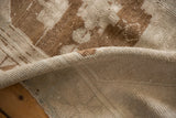 Close-up of the vintage Oushak rug's low pile texture and hand-knotted reverse.