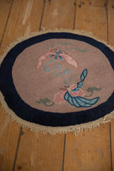 Angled view of the Art Deco mat, showing the butterfly design and intact side cord selvage.