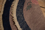 The antique rug's restored side cord selvage and even, short pile weave.