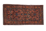 Vintage Persian Mehrivan rug with sprawling floral motifs on a dusty rose ground with sapphire blue details.