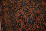 Detail of the meandering vine and floral arabesque border on a vintage Persian Mehrivan rug.