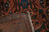 Corner of the vintage Mehrivan rug folded to show the hand-knotted weave and original fringe.