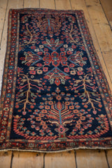 Stemmed floral pattern and madder red border on the antique Farahan Sarouk runner.