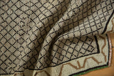 Distressed Vintage Kars runner's textured platinum pile features a charcoal diamond lattice.