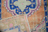 Hand-knotted foundation and side selvage detail of distressed Oushak rug.