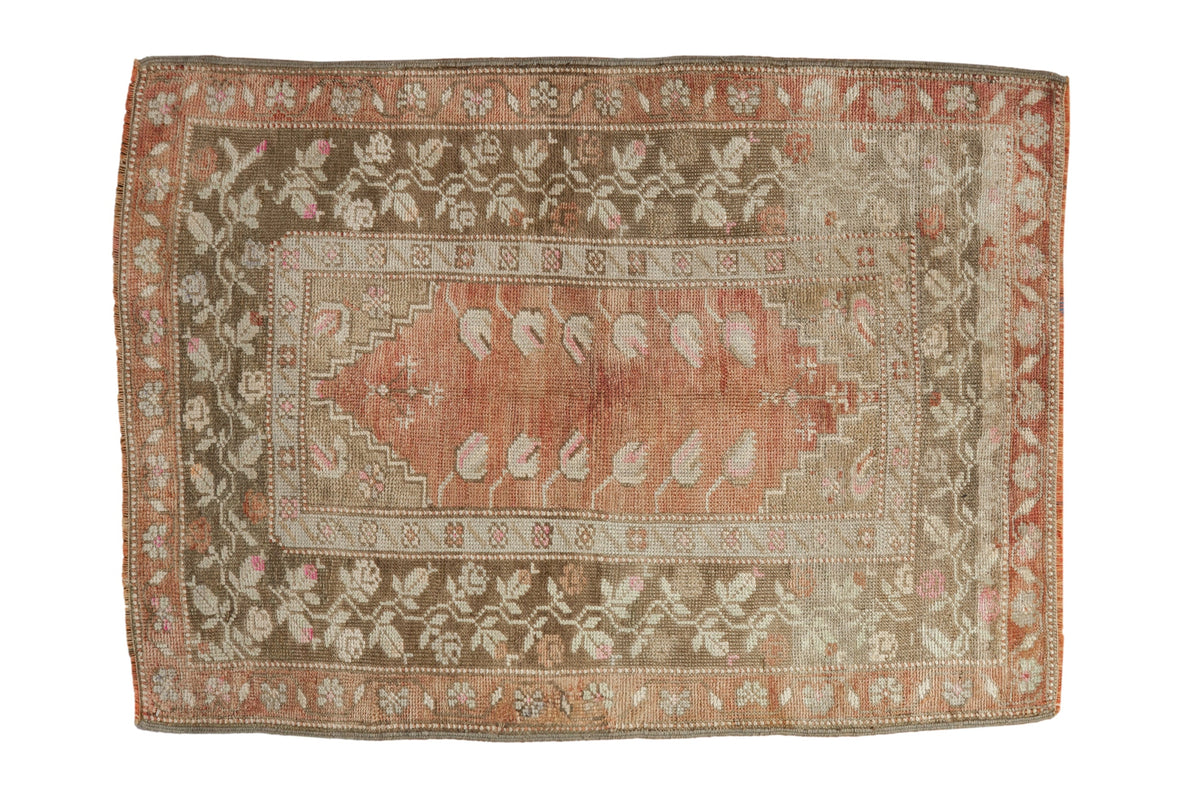 Distressed vintage Turkish Melas rug with faded terra cotta field, olive green floral borders, 2'11" x 4'.
