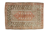 Distressed vintage Turkish Melas rug with faded terra cotta field, olive green floral borders, 2'11