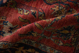 The short, even pile and rich ruby red wool of a collector-quality antique Sarouk rug.