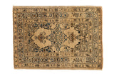 Antique Persian Tabriz rug with an intricate floral medallion on an ivory field with sapphire blue accents.