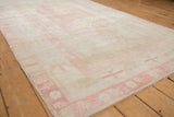 Short, even pile and soft abrash of a distressed Turkish Oushak carpet.