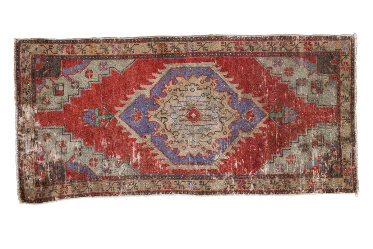 Vintage distressed Oushak rug mat with a shield medallion in cherry red, slate blue, and antique ivory.