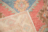 Back of a vintage Oushak rug revealing its clean, hand-knotted wool foundation.