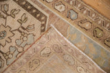 Folded vintage Oushak rug revealing hand-knotted reverse, intact selvage, and distressed pile.