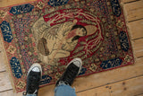 Antique Kerman pictorial rug showing the central royalty scene and scale.