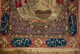 Finely knotted inscription border and short fringe on a collector's antique Pictorial Kerman mat.