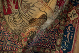 Richly colored wool pile and detailed pictorial design of a softly folded antique Kerman rug.