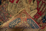 Detailed view of the hand-knotted foundation and reverse inscription border on an antique Persian Kerman.