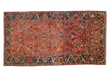 Vintage Heriz runner with a geometric allover field in gem-tones of red, navy blue, and teal.