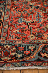 Textured wool pile and meandering arabesque border on a vintage Persian Heriz rug runner.