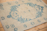 Distressed Oushak rug showing even wear on sky blue and ivory pile with secure selvage.