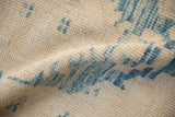 Distressed Oushak rug's heavily abrashed ground with even wear and dusty denim blue pattern.