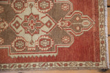 Distressed vintage Oushak rug features rust, brown serpent-like geometric motifs, worn pile, and fringe.