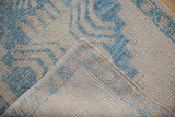 The hand-knotted foundation and secure side cord selvage of a vintage Turkish Oushak.