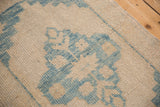 Detail of the even wear across the knot heads on a distressed Oushak rug.