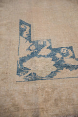 Blue painted processing mark on the woven foundation of a vintage Turkish Oushak carpet.