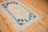 Distressed Oushak runner showing even wear and serrated cobalt blue motifs.