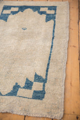 Visible knot heads and intact side cord selvage on distressed Oushak runner.