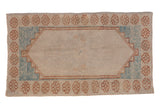 Distressed Oushak rug with ivory field, powder blue spandrels, and pale coffee floral border. 2x3.5.