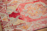 Decorative texture of distressed Oushak rug with cinnabar red field, ivory and saffron floral patterns.