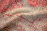 Textured vintage Oushak rug pile with distressed cinnabar red, beige, and time-softened silver tones.