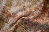 Mostly even wear across the knot heads of a distressed vintage Oushak rug.