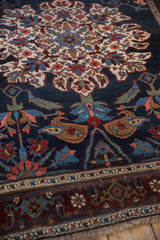 Samovar design border and sapphire blue palmettes on an antique hand-knotted Kurdish Bijar rug.