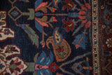 Detailed view of a boteh motif on a navy field, showing even wear to the knot heads.